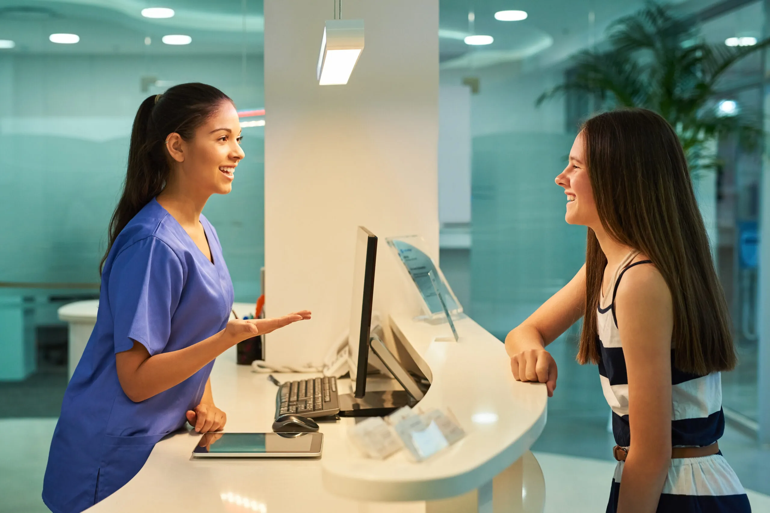 What ails you today. Shot of a young nurse assisting a patient at dana dental's reception desk